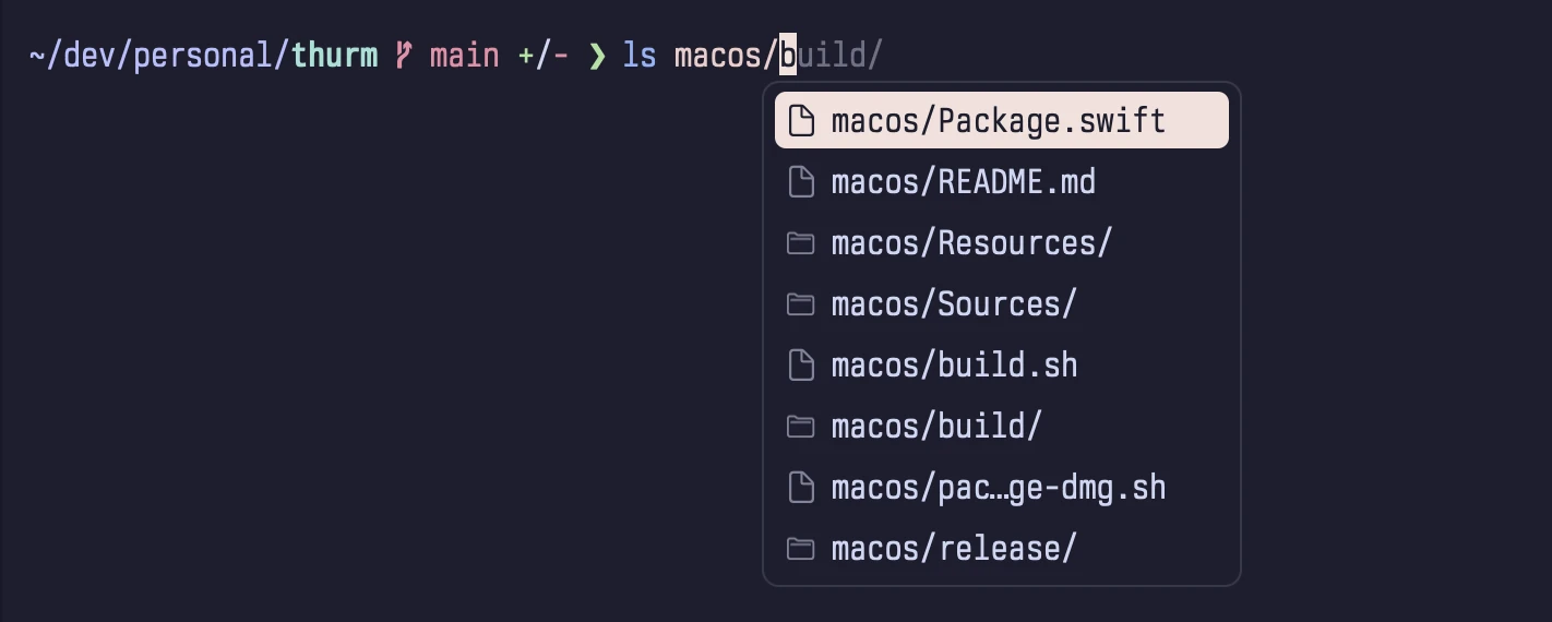 Pressing Tab after ls macos/ shows a completion menu with files and folders, each with an icon.